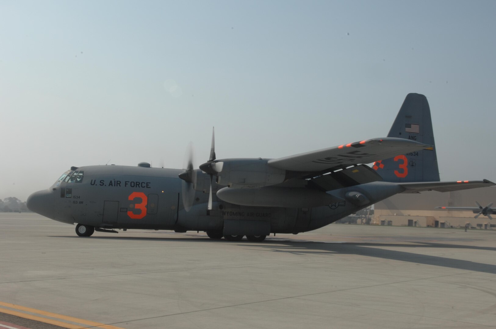A C-130 turns to taxi at Channel Islands Air National Guard Station, Calif., on Oct. 25, 2007 in support of the California firefighting efforts. The U.S. Air Force Reserve and Air National Guard are participating in the Southern California firefighting effort. 