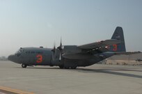 A C-130 turns to taxi at Channel Islands Air National Guard Station, Calif., on Oct. 25, 2007 in support of the California firefighting efforts. The U.S. Air Force Reserve and Air National Guard are participating in the Southern California firefighting effort. 