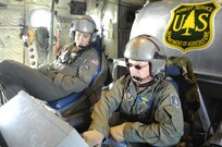 Air Force Master Sgt. Tom Freeman (right) and Tech. Sgt. Lamont Wood prepare to deploy 3,000 gallons of fire retardant over the Poomacha Fire in North San Diego county, Calif. The C-130 and crew are assigned to the 302nd Airlift Wing, Peterson Air Force Base, Colo. The aircraft launched from Channel Islands Air National Guard Station, Calif., Oct., 26, 2007. The US Air Force Reserves is participating in the Southern California firefighting effort. 