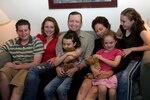 The Donoghue family was forced to evacuate their home moments before it was overtaken by a wildfire in southern California. The family has received assistance from March Air Force Base, Calif., and various military and community organizations. From left to right are Andrew, Madison, Kiera, Brendan, Rosalind, Kendra and Shavonne. 
The Donoghue family from left to right:  Andrew, Madison, Kiera, Brendan, Rosalind, Kendra and Shavonne.  
