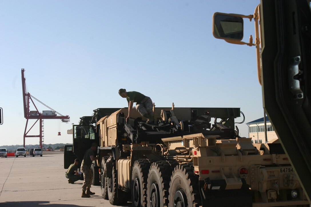 Marines from the Marine Expeditionary Force aboard Camp Lejeune, N.C., inspect vehicles prior to starting a Marine Prepositioning Force Exercise aboard Marine Corps Support Facility Blount Island, Fla., May 24, 2013. This exercise was the first one that II MEF has conducted on its own in five years.  (U.S. Marine Corps photo by Lance Cpl. Shawn Valosin)