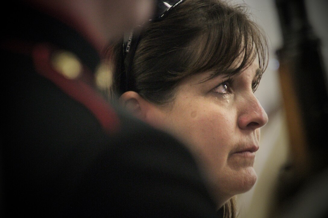 Kathy Rusk, the mother of Marine Lance Cpl. Colton Rusk, tears up during a dedication ceremony in his honor at Miami International Airport May 31, 2013. Miami-Dade Police and the Transportation Security Administration memorialized Rusk, who was killed by a sniper while serving in Afghanistan as a dog handler, by naming their new canine training center in his memory. County officials also issued a proclamation making the Rusk family honorary residents of Miami-Dade County.