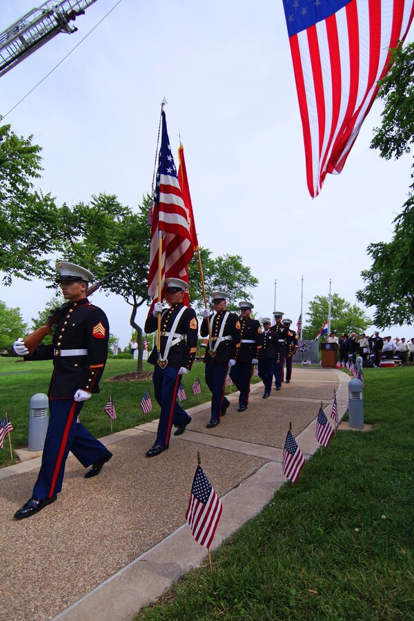 Marines with Recruiting Station St. Louis retire the colors at a Memorial Day Ceremony in St. Peters, Mo. During the ceremony 15 poolees were sworn into the United States Marine Corps. (U.S. Marine Corps photo by Cpl. Erik S. Brooks Jr.)