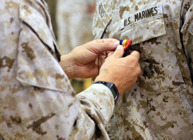 Col. Frank Donovan, the former commanding officer of the 24th Marine Expeditionary Unit, pins a Navy and Marine Corps Medal on a Marine during an awards ceremony June 3, 2013, at Camp Lejeune, N.C. The medals were awarded to the Marines for heroic actions while deployed with the 24th MEU in 2012. The Navy and Marine Corps Medal is the highest non-combatant medal awarded by the Department of the Navy to member of the U.S. Navy and Marine Corps.

