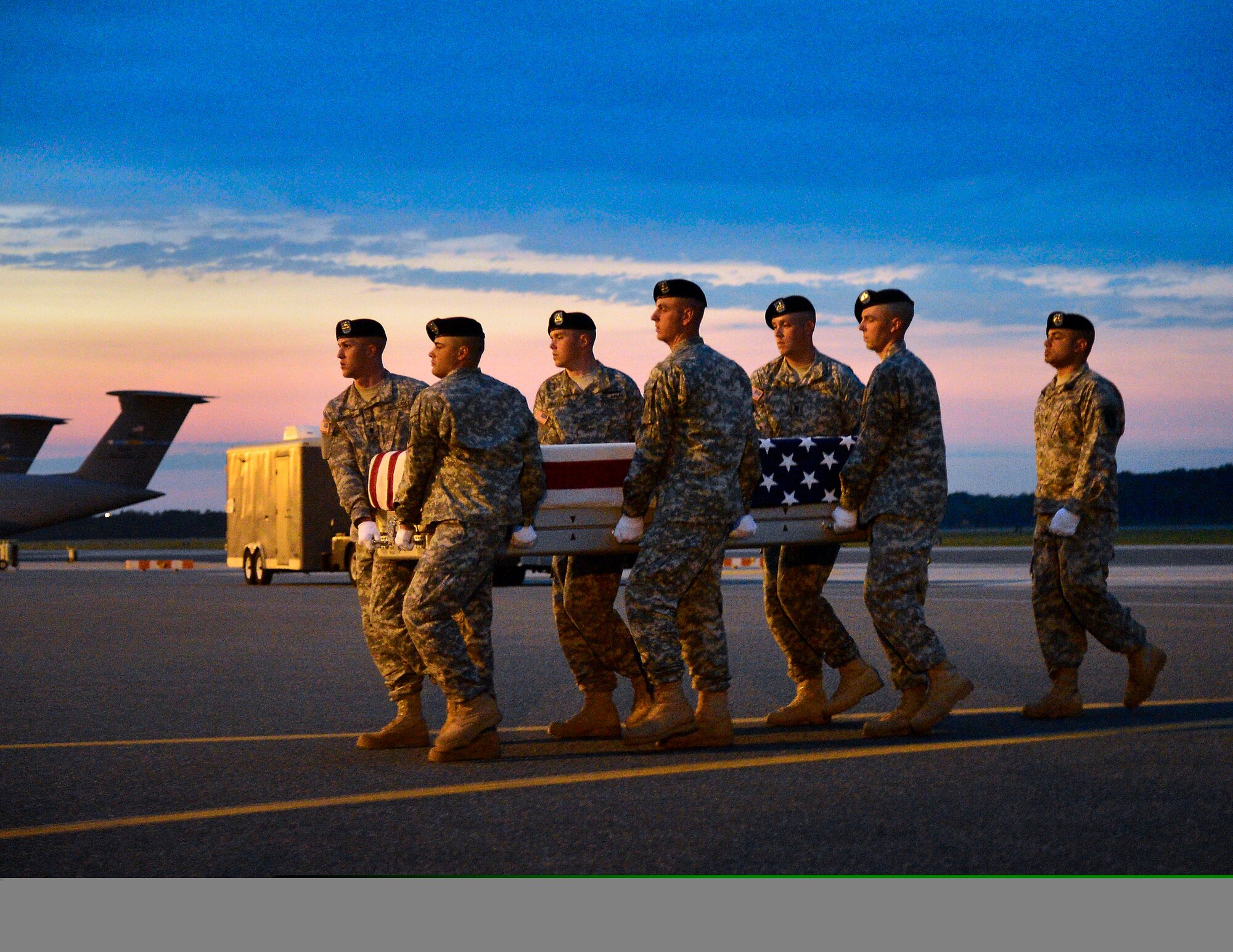 A U.S. Army carry team transfers the remains of Army Spc. Ray A. Ramirez of Sacramento, Calif., at Dover Air Force Base, Del., on June 3, 2013. Ramirez was assigned to the 3rd Battalion, 15th Infantry Regiment, 4th Infantry Brigade Combat Team, 3rd Infantry Division, Fort Stewart, Ga. (U.S. Air Force photo/David Tucker)
