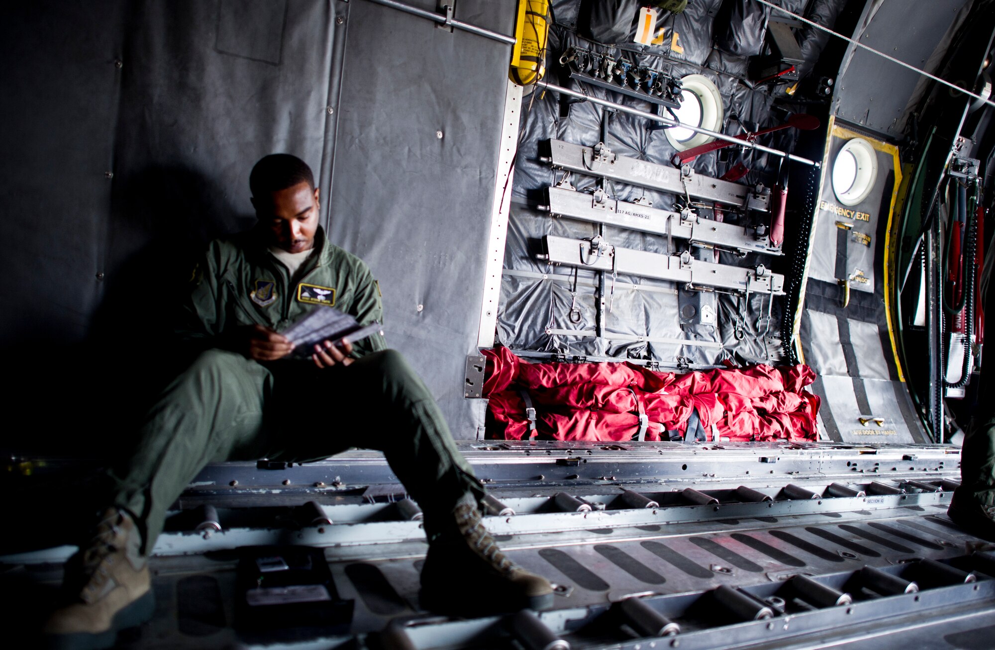 YOKOTA AIR BASE, Japan -- Staff Sgt Byron Simon, flight engineer with the 36th Airlift Squadron performs pre-flight checks aboard a C-130 May 29, 2013 at Yokota Air Base, Japan. Members from Yokota participate in exercise Airborne Tomahawk with joint services to evaluate rigging and movement procedures and execute airdrop resupply. (U.S. Air Force photo by Staff Sgt. Stacy Moless)  