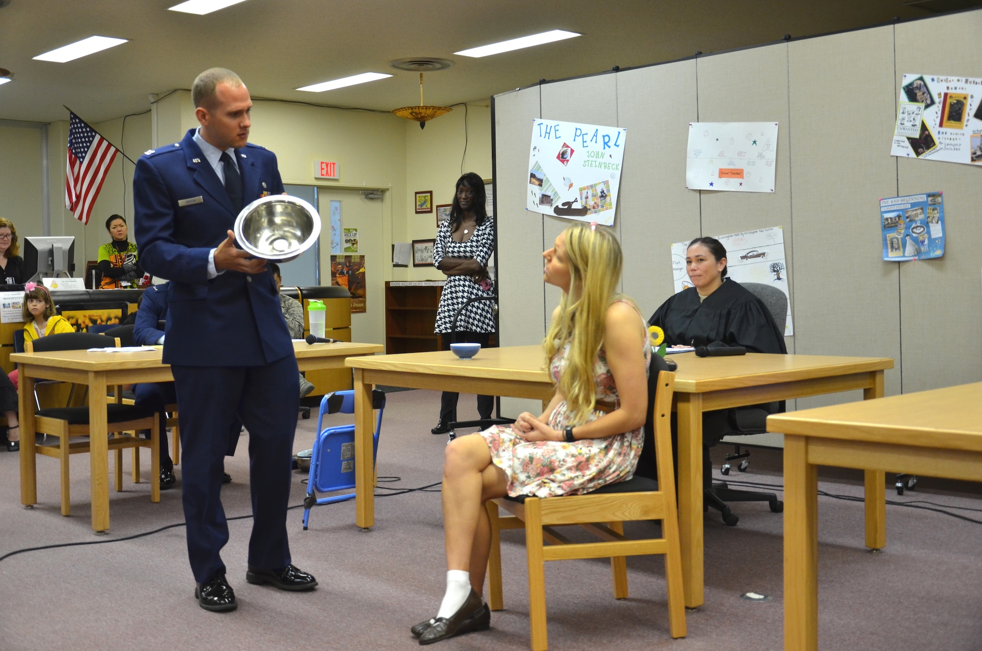 U.S. Air Force Capt. Kevin Cayton, area defense counsel, as defense counsel interviews Gold E. Locks, played by Capt. Sarah Rogers, 18th Wing judge advocate, during a mock trial at Kadena Middle School on Kadena Air Base, Japan, May 23, 2013. The Goldilocks trial was part of a mock court presentation, sponsored by the Kadena Legal Office, Area Defense Counsel’s Office, and other members of the Kadena community. (U.S. Air Force photo by Senior Master Sgt. Daniel Kazumura/Released)