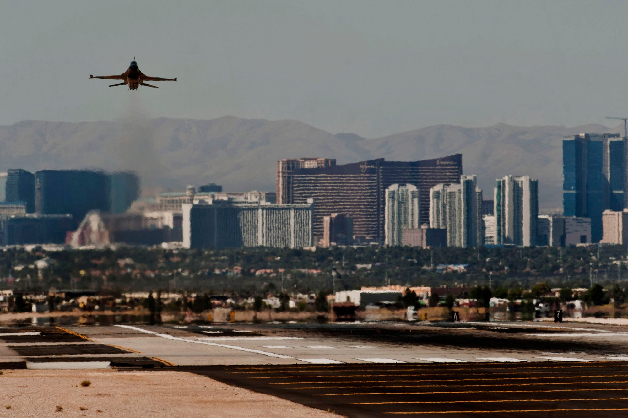 An F-16 Fighting Falcon assigned to the 64th Aggressor Squadron takes off
from Nellis Air Force Base, Nev., to participate in a Joint Forcible Entry
exercise over the Nevada Test and Training Range May 31. Under the Air Combat Command stand down that took effect June 1, the aggressors will be grounded through the
end of the fiscal year. (U.S. Air Force photo by Senior Airman Daniel
Hughes)
