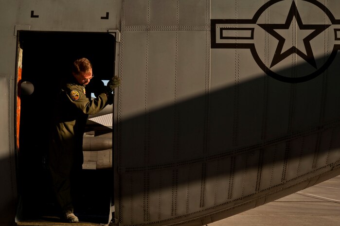 U.S. Air Force Master Sgt. Dave Rae, 29th Weapons Squadron loadmaster, Little Rock Air Force Base, Ark., checks the jump platform on a C-130 Hercules before taking part in a Joint Forcible Entry exercise May 31, 2013, at Nellis Air Force Base, Nev. Rae inspects the ramp to ensure it is connected correctly and secure. (U.S. Air Force photo by Senior Airman Daniel Hughes)