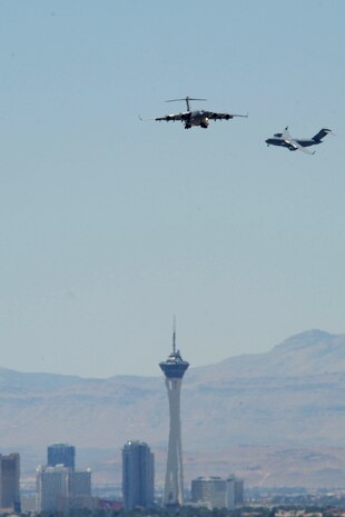 C-17 Globemaster IIIs participating in the Joint Forcible Entry Exercise prepare to land May 31, 2013, at Nellis AFB, Nev. JFEX is a U.S. Air Force Weapons School large-scale air mobility exercise in which students plan and execute a complex air-land operation on a simulated contested battlefield. (U.S. Air Force photo by Tech. Sgt. Taylor Worley)