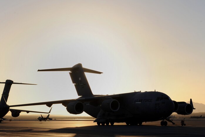 A C-17 Globemaster III from McChord Air Force Base, Wash. sits on the Nellis AFB flightline before the start of the Joint Forcible Entry Exercise May 31, 2013, at Nellis AFB, Nev. JFEX is a U.S. Air Force Weapons School large-scale air mobility exercise in which students plan and execute a complex air-land operation on a simulated contested battlefield. (U.S. Air Force photo by Tech. Sgt. Taylor Worley)