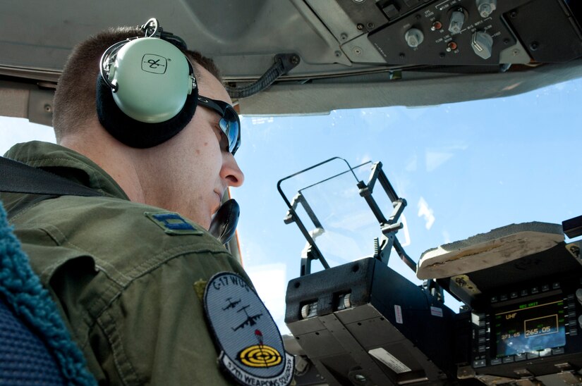 Cpt. Matthew Purcell, 57th Weapons Squadron C-17 Globemaster III pilot, checks aircraft instruments before take-off May 31, at Nellis Air Force Base, Nev. Purcell was participating in the Joint Forcible Entry exercise, during which pilots’ flying skill and decision making was tested in the execution of various missions in a contested environment. (U.S. Air Force photo by Airman 1st Class Joshua Kleinholz)