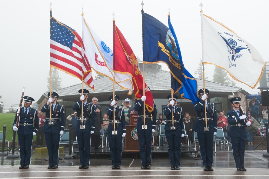Ellsworth Air Force Base Honor Guard members present the U.S. Flag and flags representing the five military service branches during the Memorial Day Ceremony at the Black Hills National Cemetery in Sturgis, S.D., May 27, 2013. Formerly known as Decoration Day, Memorial Day was established to commemorate U.S. servicemembers who died while serving their country. (U.S. Air Force photo by Senior Airman Kate Maurer/Released)