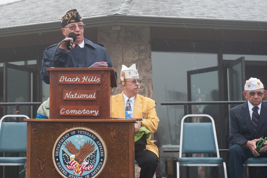 Ron Millage, South Dakota American Legion National Cemetery chairman, welcomes members of the Black Hills community to the Memorial Day Ceremony at the Black Hills National Cemetery in Sturgis, S.D., May 27, 2013. More than 1,200 people participated in the ceremony and paid their respects to past servicemembers who gave their lives protecting the U.S. (U.S. Air Force photo by Senior Airman Kate Maurer/Released)