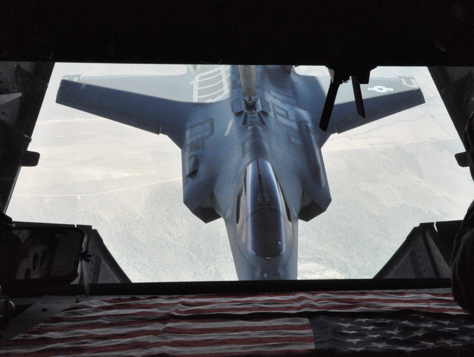 A F-35 Lightning II is refuled May 22 by Travis' KC-10 Extender during the fini flight of Col. J.C. Millard, 60th Opreations Group commander, and as Chief Master Sgt. Luis Drummond, 60th Operations Group superintendent, passed 10,000 hours as a boom operator.  (U.S. Air Force Photo/2nd Lt. Jessica Clark)