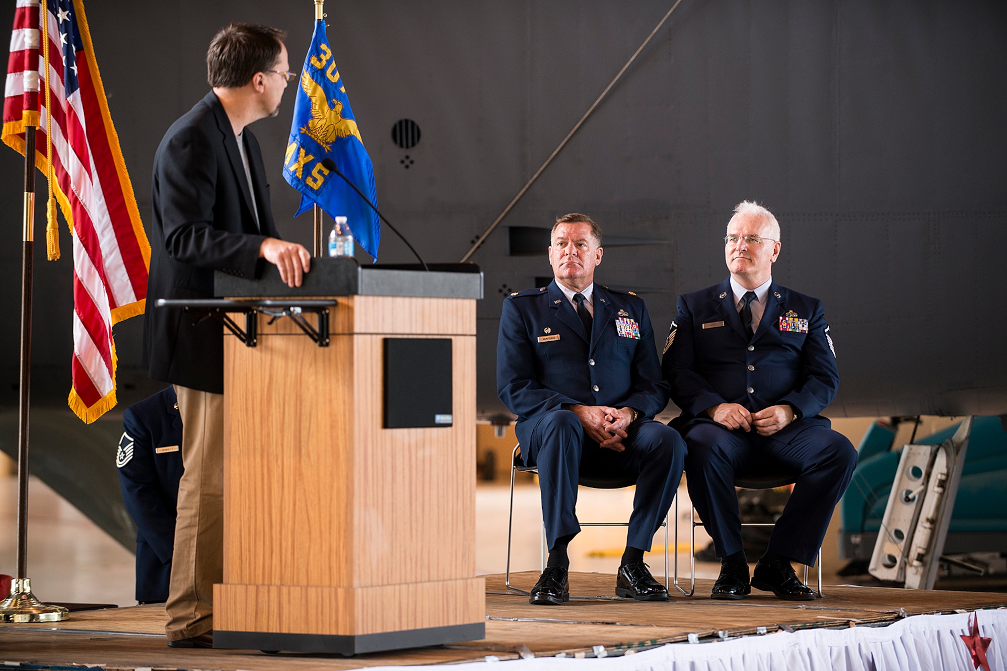 James Hughes, pastor of the Willowpoint Baptist Church, speaks during the retirement ceremony for U.S. Air Force Master Sgt. Harold Agee, right, May 31, 2013, Barksdale Air Force Base, La. Agee is assigned to the 307th Maintenance Squadron and is retiring from the Air Force Reserve after 35 years of service. (U.S. Air Force photo by Master Sgt. Greg Steele/Released)