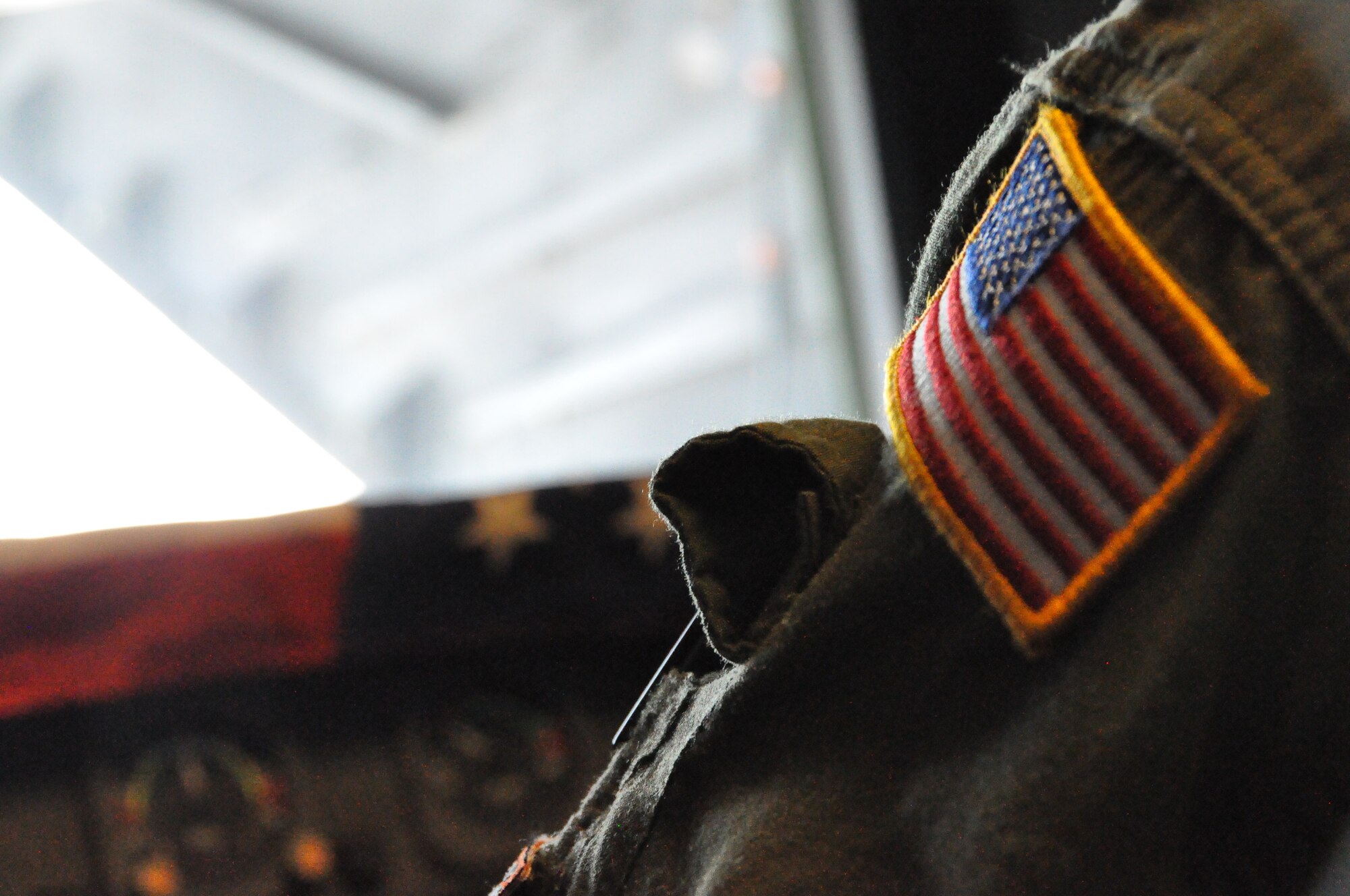Chief Master Sgt. Luis Drummond, 60th Operations Group superintendent, keeps a U.S. flag with him as a reminder of our freedom and those who have made the ultimate sacrifice for our country.  (U.S. Air Force Photo/2nd Lt. Jessica Clark)