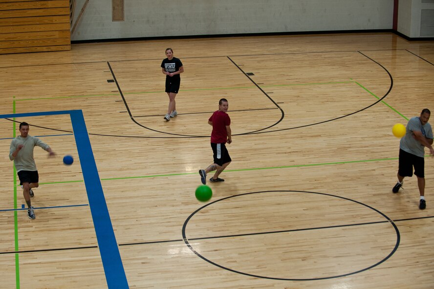 Airmen assigned to the 28th Maintenance Squadron Aerospace Ground Equipment section participate in a lunchtime dodgeball tournament in the Bellamy Fitness Center at Ellsworth Air Force Base, S.D., May 21, 2013. The 28th Force Support Squadron hosted the three-game tournament in an effort to promote fitness month. (U.S. Air Force photo by Airman 1st Class Alystria Maurer/Released)