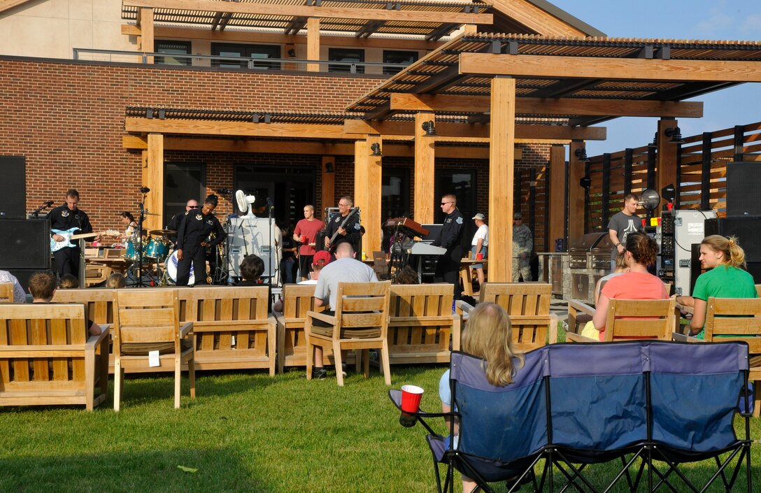 Max Impact, The U.S. Air Force Band's premiere rock ensemble, performs for a crowd at the USO Warrior and Family Center on Ft. Belvoir, Va., May 22, 2013. The newly-opened center held a free community-wide barbecue in order to garner future attendance at upcoming USO events. (U.S. Air Force photo/Senior Airman Lindsey A. Porter)