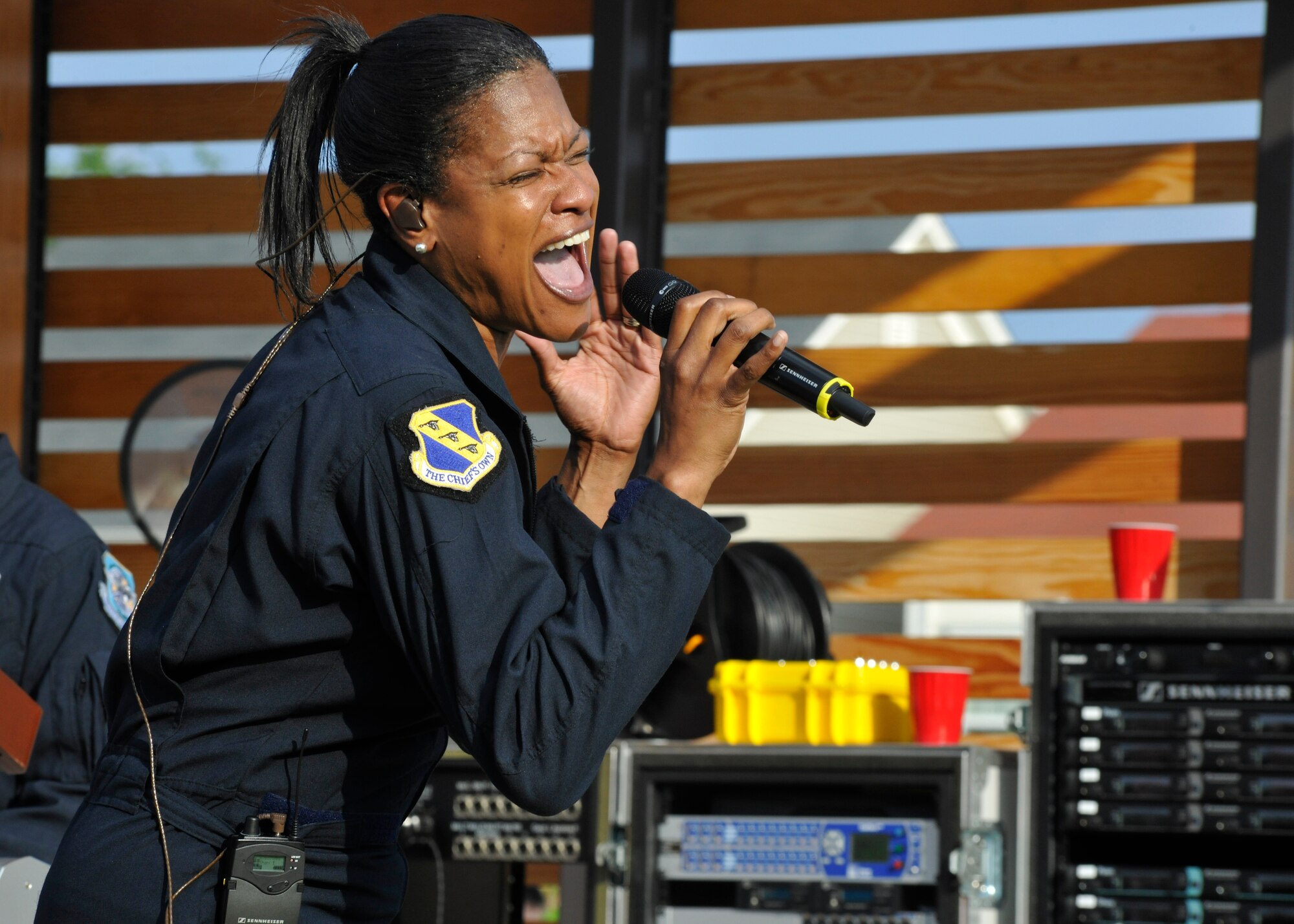 Master Sgt. Shani Prewitt, Max Impact vocalist, performs for a crowd at the USO Warrior and Family Center on Ft. Belvoir, Va., May 22, 2013. Along with entertaining the crowd during the community-wide event, Max Impact became the first musical ensemble to perform at the newly-opened center. (U.S. Air Force photo/Senior Airman Lindsey A. Porter)