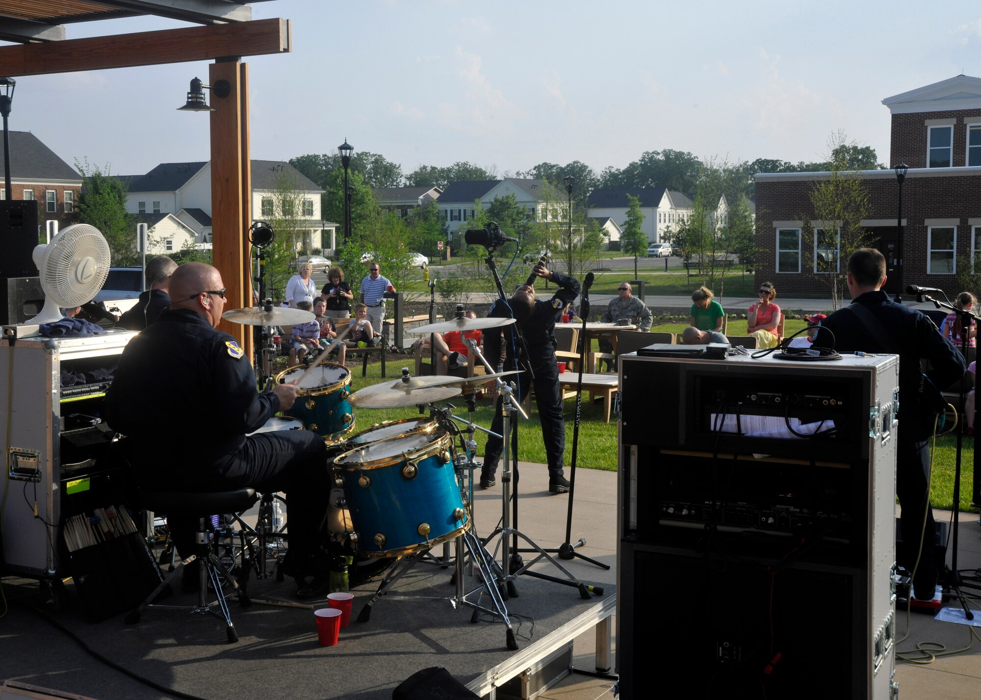 Max Impact, The U.S. Air Force Band's premiere rock ensemble, performs for a crowd at the USO Warrior and Family Center on Ft. Belvoir, Va., May 22, 2013. The newly-opened center held a free community-wide barbecue in order to garner future attendance at upcoming USO events. (U.S. Air Force photo/Senior Airman Lindsey A. Porter)
