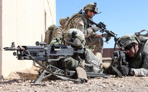 Soldiers from the 2nd Brigade Combat Team, 1st Infantry Division, pull security during a training exercise at the National Training Center in Fort Irwin, Calif., Feb. 19, 2013. Incorporating Wide Area Security and Combined Arms Maneuver, this training exercise is designed to evaluate 2nd Brigade Combat Team, 1st Infantry Division's capabilities and abilities against an equally sized and equipped adversary. (U.S. Army photo by Sgt. Eric M. Garland/Released)