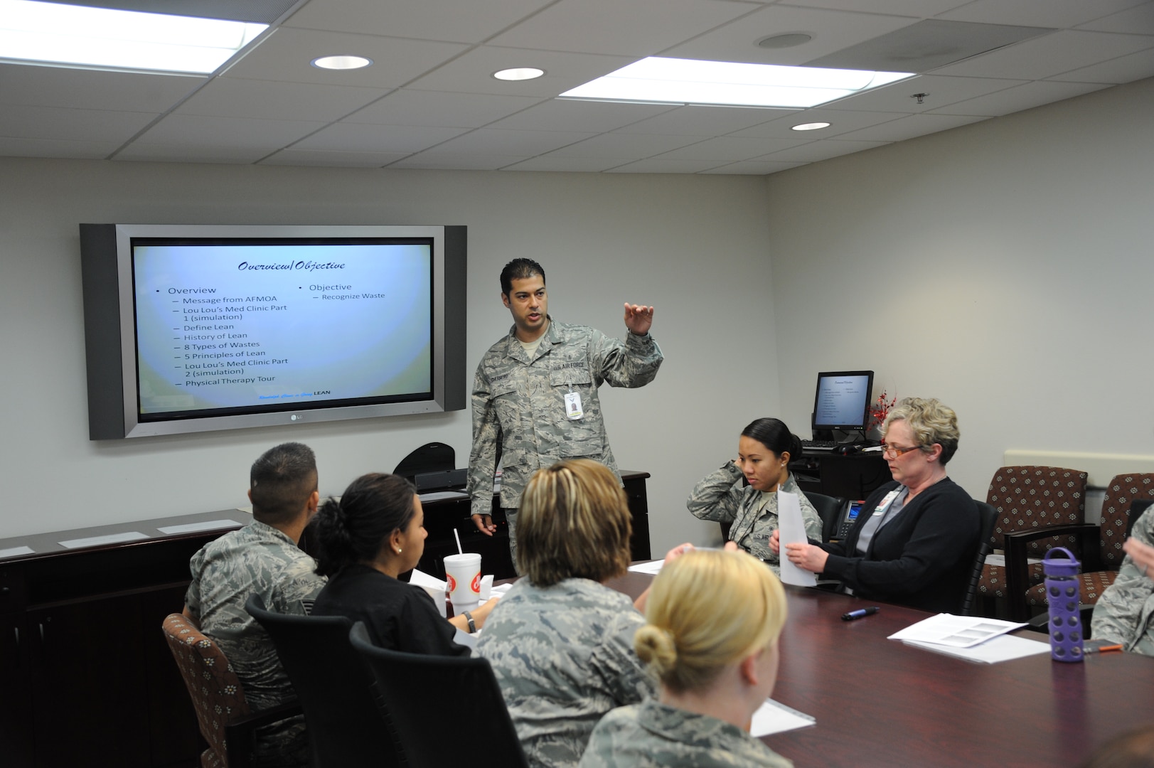 Tech. Sgt. Rolando Guerrero, 359th Medical Operation Squadron physical therapy flight chief, conducts a "lean" workshop clinic personnel at the Randolph May 29 at the Joint Base san Antonio-Randolph Medical Clinic. Participants formed teams and simulated clinic operations to find ways they can improve processes to save resources and eliminate waste in the delivery of health care services. (U.S. Air Force photo by Rich McFadden)