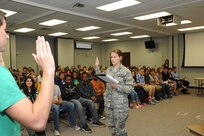 Capt. Anna Rehder, 902nd Mission Support Group Judge Advocate Office chief of civil law, swears in a witness during a mock trial hosted May 21 at Randolph High school. The trial was hosted to raise awareness of legal professions and the military justice system.  (U.S. Air Force photo by Rich McFadden)