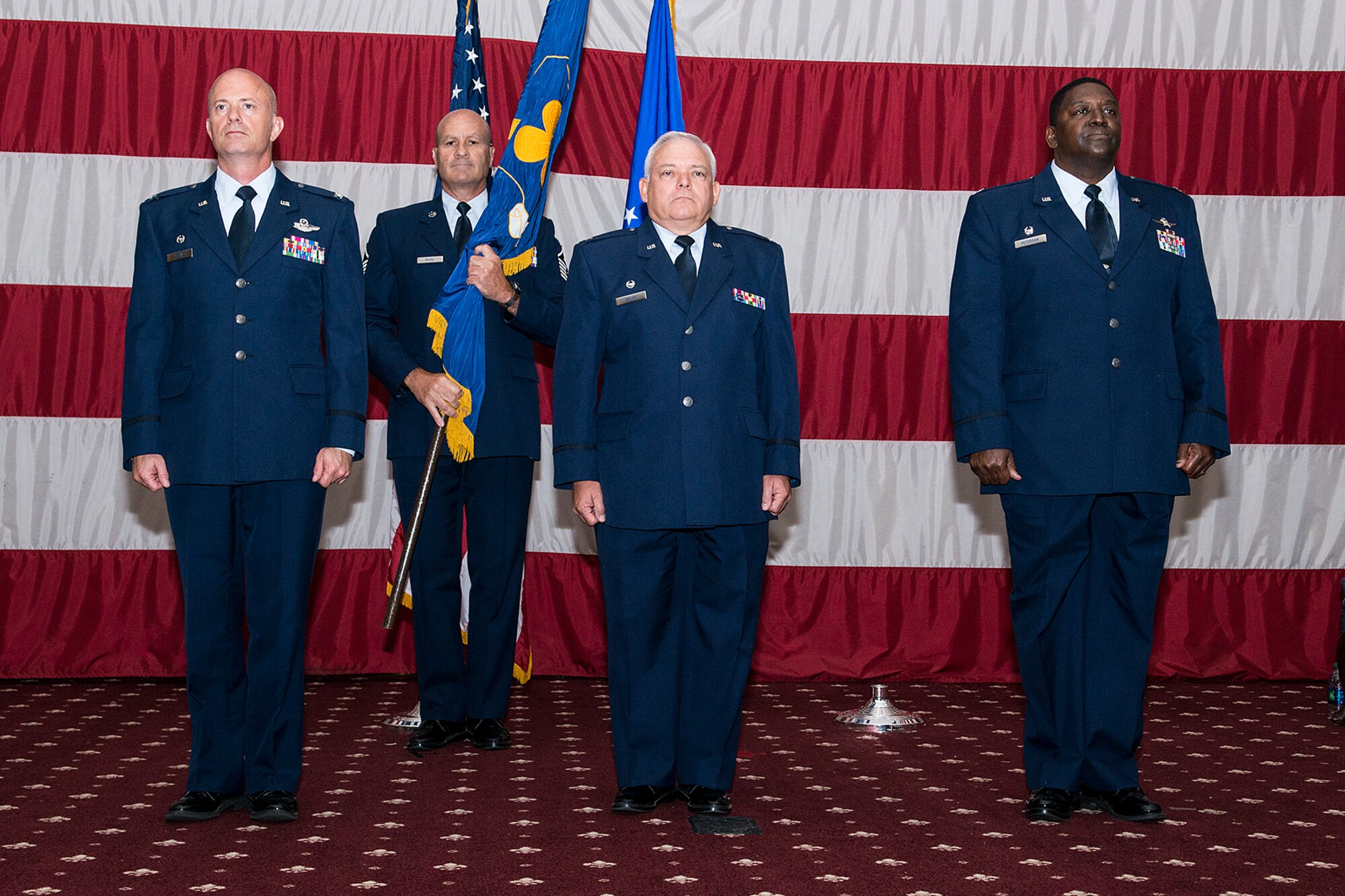 The 307th Mission Support Group holds a Change of Command Ceremony, June 1, 2013, Barksdale Air Force Base, La. U.S. Air Force Col. Kevin Wolfe, center, is relinquishing command to Col. Roy Peterson, right. (U.S. Air Force photo by Master Sgt. Greg Steele/Released)