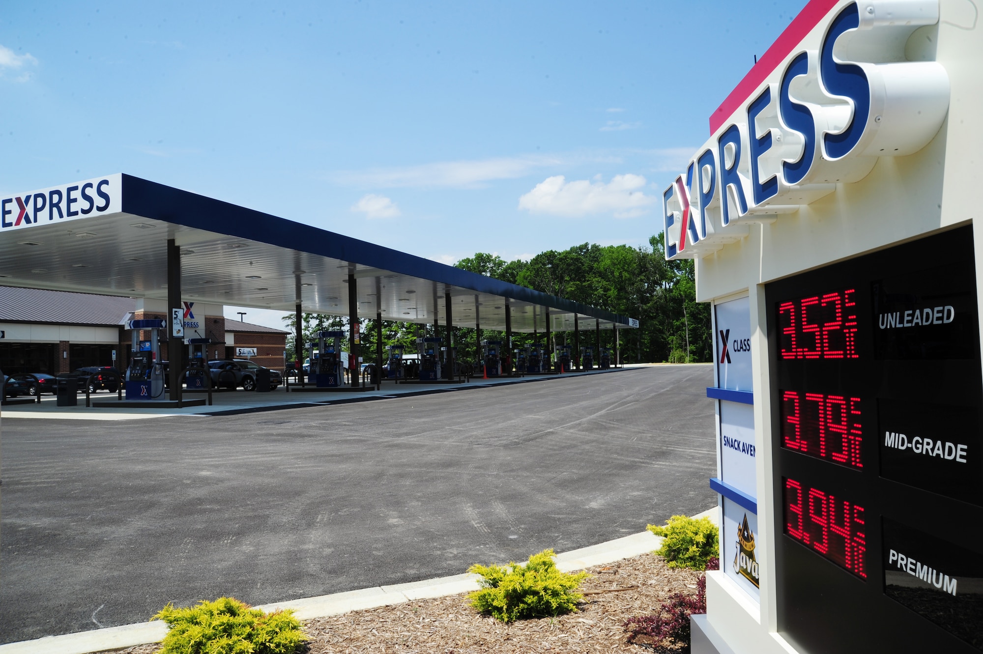 Customers fill up their gas tanks at the newly opened Express Shoppette on Joint Base Andrews, Md., May, 29, 2013. Due to the new construction, Andrews team members should be aware the current gas station will be closing after transition to the new site is complete. (U.S. Air Force photo/Airman 1st Class Erin O’Shea)                         