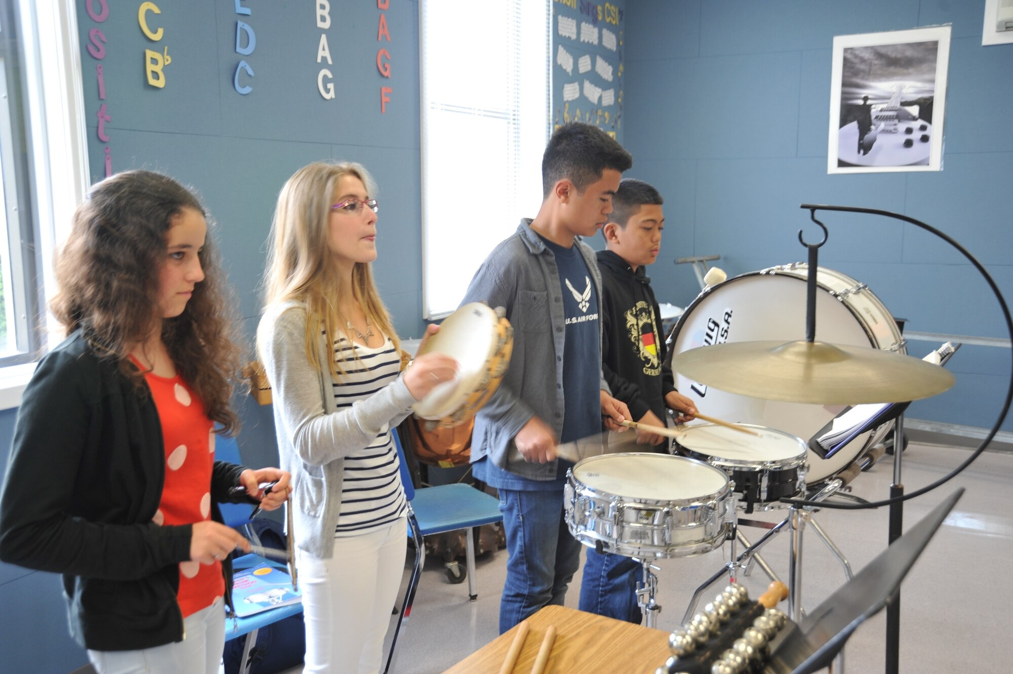 Bruna Martins (left), 14, and Barbara Vieira (second from left), 15, participate in band class during a student-exchange program at the Lajes Elementary/High School May 30. Both are Portuguese 8th grade students from the Thomas Borba School, a public school in the village of Angra do Heroismo, Azores, Portugal. (U.S. Air Force photo by Staff Sgt. Angelique N. Smythe)