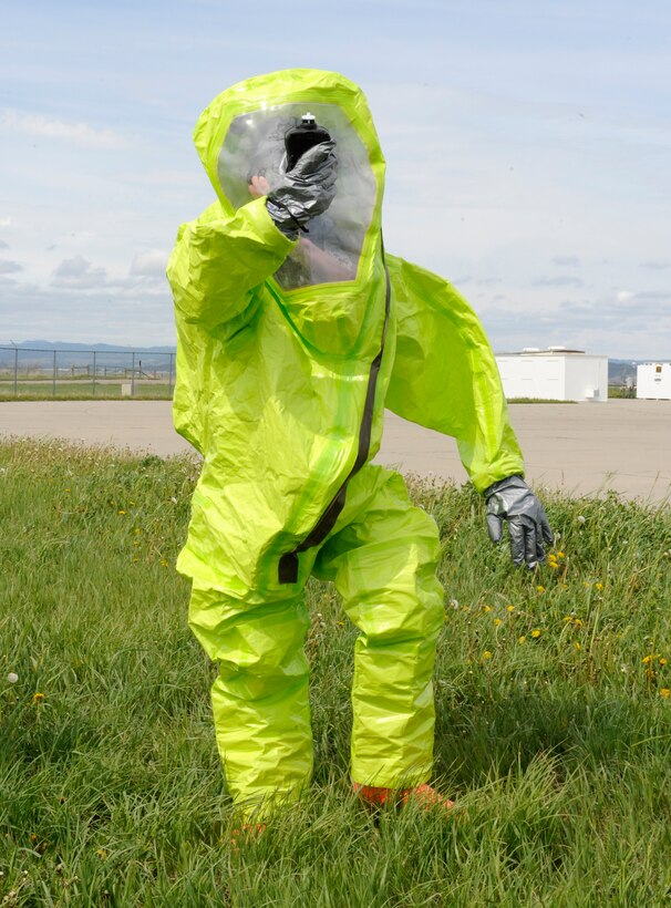 Airman 1st Class Ricky Schutter, 28th Civil Engineer Squadron emergency management technician, tests the air for chemicals with a multi-ray detector during a training exercise at Ellsworth Air Force Base, S.D., May 23, 2013. The simulation tested the ability of bioenvironmental engineering, emergency management and ambulance services Airmen to respond to a potentially hazardous liquid spill on base. (U.S. Air Force photo by Airman 1st Class Ashley J. Thum/Released)