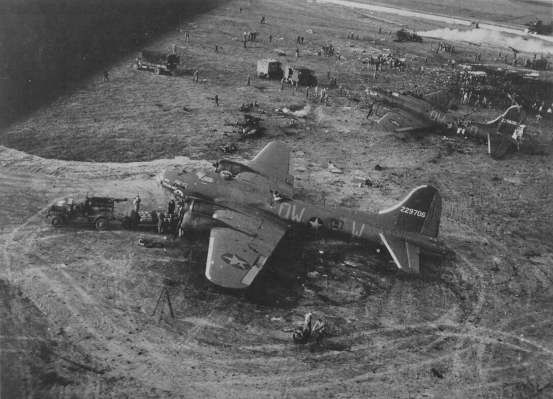 RAF ALCONBURY, United Kingdom – Two of the B-17 Flying Fortresses that were damaged by an explosion at RAF Alconbury on May 27, 1943, sit on the flightline. Nineteen United States Army Air Force 95th Bombardment Group Airmen were killed and 21 others were injured when a 500-pound bomb detonated on the flightline. A memorial plaque was placed in their honor at Alconbury Airfield May 27, 2013. (Photo courtesy AFRA)