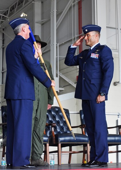Lt. Col. John Aalborg, the new 6th Special Operations Squadron commander, salutes Brig. Gen. Jon Weeks, commander of the Air Force Special Operations Air Warfare Center, during the unit’s change of command ceremony May 31, 2013 at Duke Field, Fla.  Aalborg’s active-duty squadron recently moved to Duke from Hurlburt Field and reports to AFSOAWC as it conducts aviation foreign internal defense and combat aviation advisor missions.  (U.S. Air Force photo/Dan Neely)