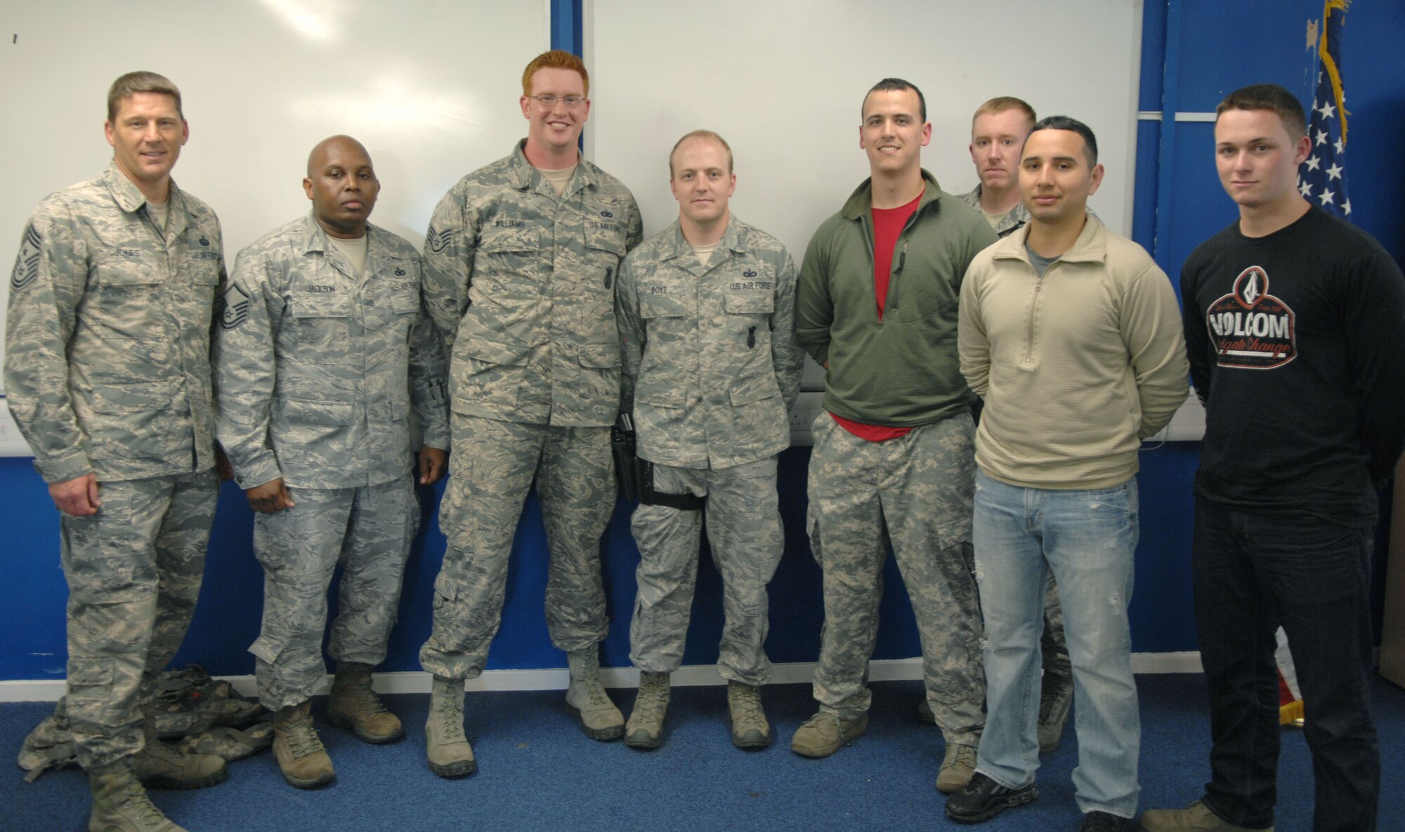 From left, Chief Master Sgt. Tracy Jones, 100th Air Refueling Wing command chief, poses with 100th Security Forces Squadron members after the use-of-force and active-shooter training May 31, 2013, at RAF Mildenhall, England. 100th SFS members trained Jones in several scenarios, assessing his ability to determine the proper level of force to use. (U.S. Air Force photo by Airman 1st Class Dillon Johnston/Released)