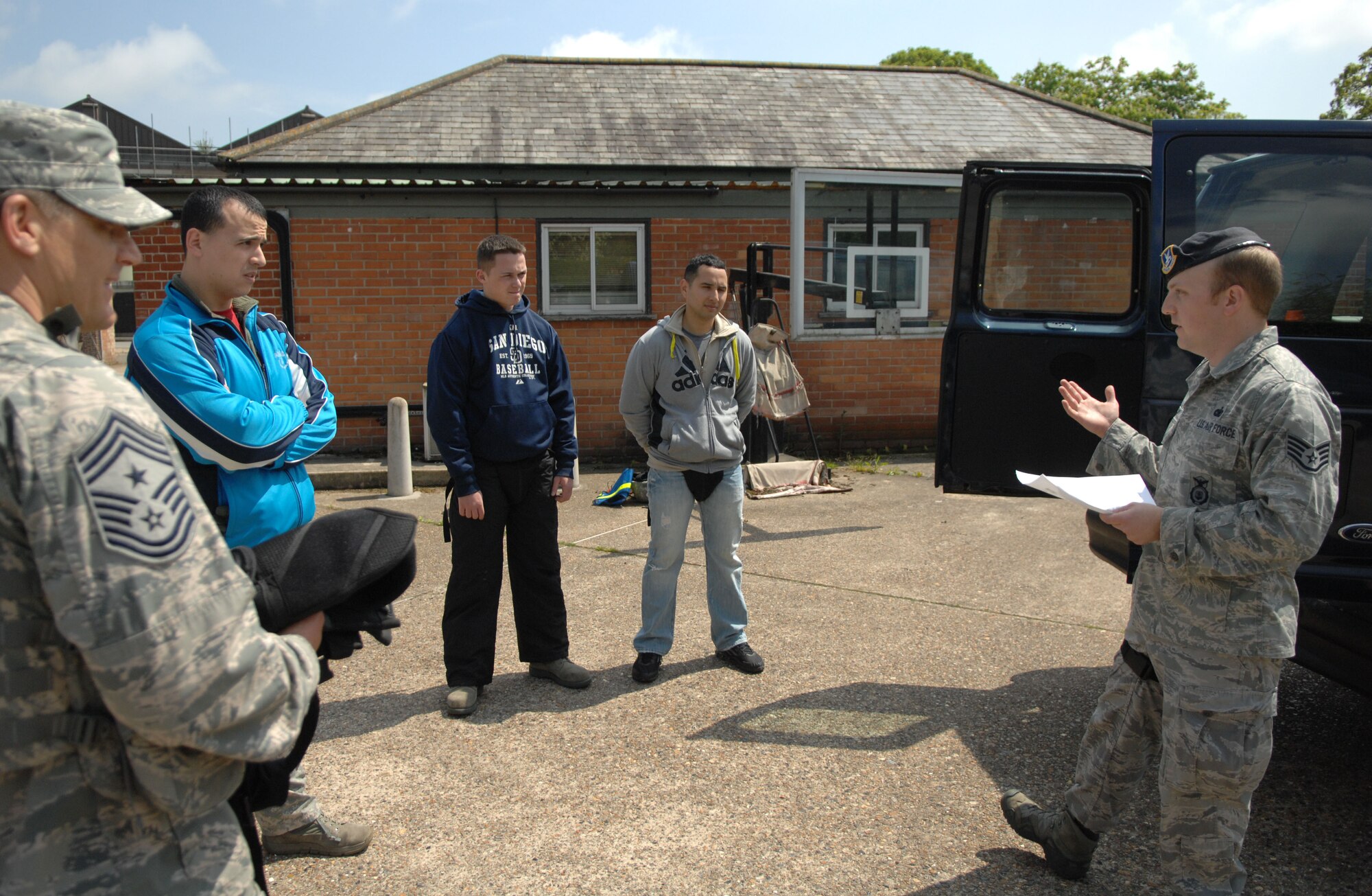 From right, Staff Sgt. Houston Boyt, 100th Security Forces trainer from Natchitoches, La., briefs Team Mildenhall members prior to performing use-of-force and active-shooter training May 29, 2013, at RAF Mildenhall, England. The 100th SFS trained Chief Master Sgt. Tracy Jones, 100th Air Refueling Wing command chief, as part of the “dirty jobs” program. (U.S. Air Force photo by Airman 1st Class Dillon Johnston/Released)