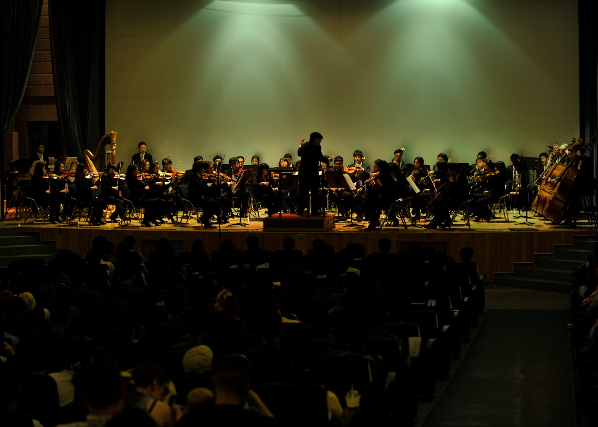Members of the Gyeonggi Philharmonic Orchestra perform at the base theater on Osan Air Base, Republic of Korea, May 31, 2013. The orchestra, the Gyeonggi Province’s official orchestra, performed sets from different plays, operas and ballets to include The Nutcracker. (U.S. Air Force photo/Senior Airman Siuta B. Ika)