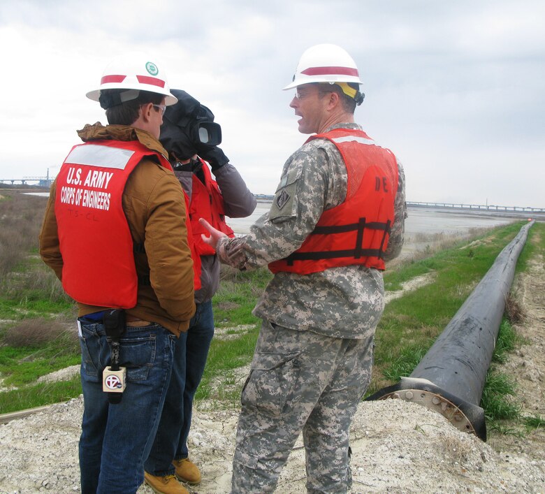 Lt. Col. Ed Chamberlayne gives an interview to members of the media about the Clouter Creek Disposal Area