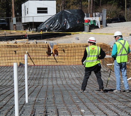 Inspecting the Legion Pool under construction.