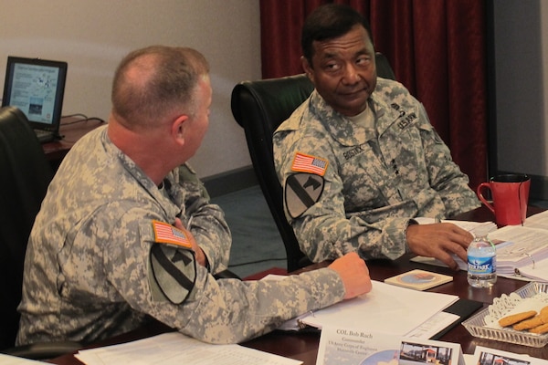 Commanding General of the U.S. Army Corps of Engineers Lt. Gen. Thomas Bostick, right, gathers information about the Huntsville Center mission from Col. Bob Ruch, Huntsville Center commander, during a mission brief May 28.