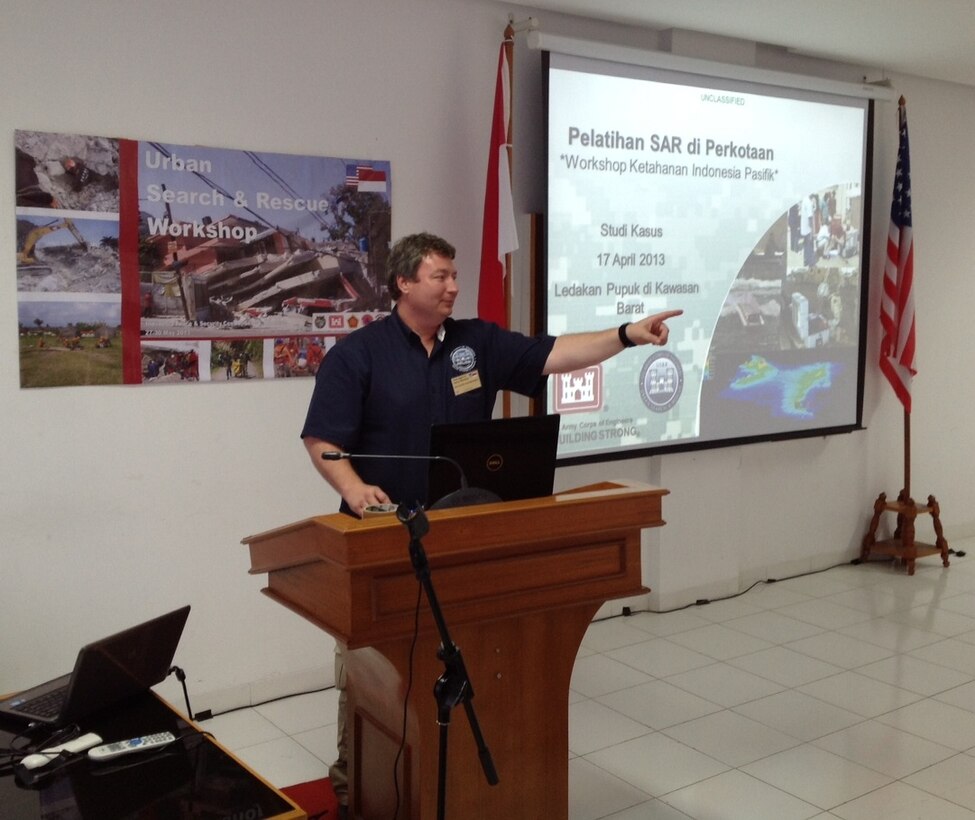 Dustin Tellinghuisen, from U.S. Army Corps of Engineers Buffalo District, answers a question during the 2013 Indonesia Urban Search & Rescue Workshop. The U.S. Pacific Command sponsored the three-day workshop, which was conducted in partnership with the Government of Indonesia. The U.S. instruction team, which was comprised of subject matter experts from the U.S. Army Corps of Engineers, University of Wyoming, and Texas A&M University, helped to raise awareness about structural engineering in urban search and rescue missions by demonstrating techniques and sharing best practices used in the U.S. and around the world. 