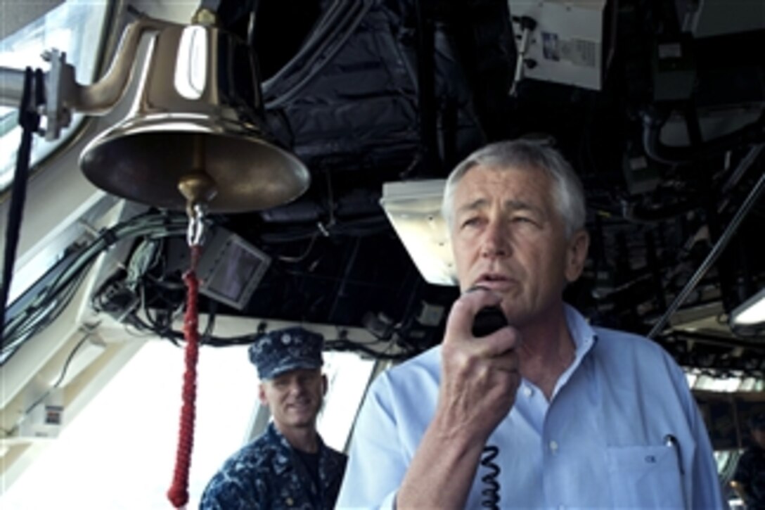 Secretary of Defense Chuck Hagel addresses the crew of the USS Freedom (LCS 1) from the ship’s bridge in Singapore on June 2, 2013.  Hagel is touring the ship to visit with the crew and to watch a demonstration of a reconfigurable and waterborne mission.  Freedom is the Navy’s first littoral combat ship and is forward deployed for operations out of Singapore.  