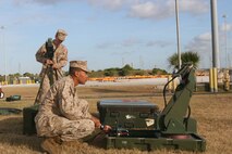 Marines from II Marine Expeditionary Force set up a very small aperture terminal, VSAT, for use in a Marine Prepositioning Force Exercise conducted aboard Marine Corps Support Facility Blount Island, Fla., May 28, 2013. The VSAT was used to transmit data from the arrival and assembly operations element to other sections during the MPF exercise. (U.S. Marine Corps photo by Lance Cpl. Shawn Valosin)