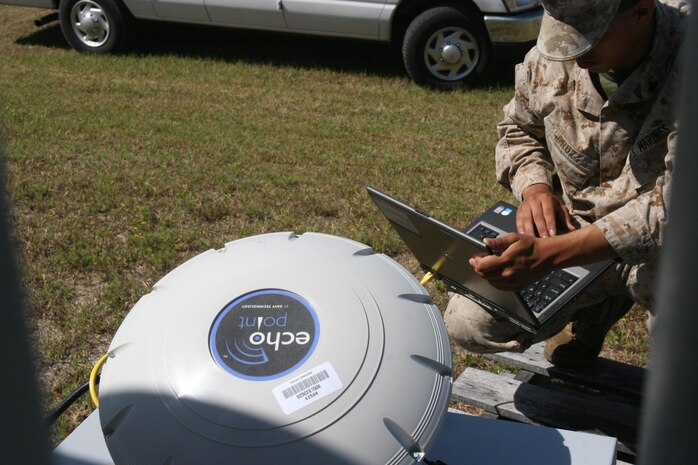 A Marine from the II Marine Expeditionary Force sets up an interrogatory aboard Marine Corps Support Facility Blount Island, Fla., during a Marine Prepositioning Force Exercise, May 27, 2013. Four interrogators were set up around base to track movements of equipment from a Navy lighterage vessel to designated areas.  (U.S. Marine Corps photo Lance Cpl. Shawn Valosin)