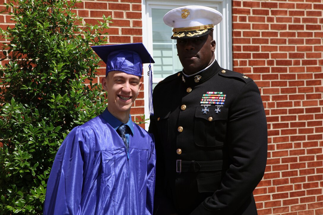Maj. LeRon E. Lane, a Cherry Point, N.C., native and Assistant Chief Of Staff G-6, 2nd Marine Logistics Group, poses with Steven C. James, a Nashville, N.C., native, after a graduation from the Christian Home School Association in Rocky Mount, N.C., June 1, 2013. In 2012, Lane invited James to come to Camp Lejeune to take a tour of the base and to experience life as a Marine for a day. 