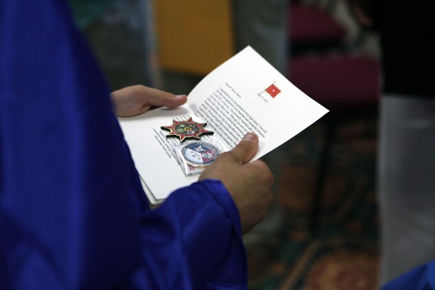 Steven C. James, a Nashville, N.C., native, reads a letter from Brig. Gen. Edward D. Banta, the commanding general of 2nd Marine Logistics Group, in Rocky Mount, N.C., June 1, 2013. James received many tokens, challenge coins, letters and two flags from the 2nd MLG. 