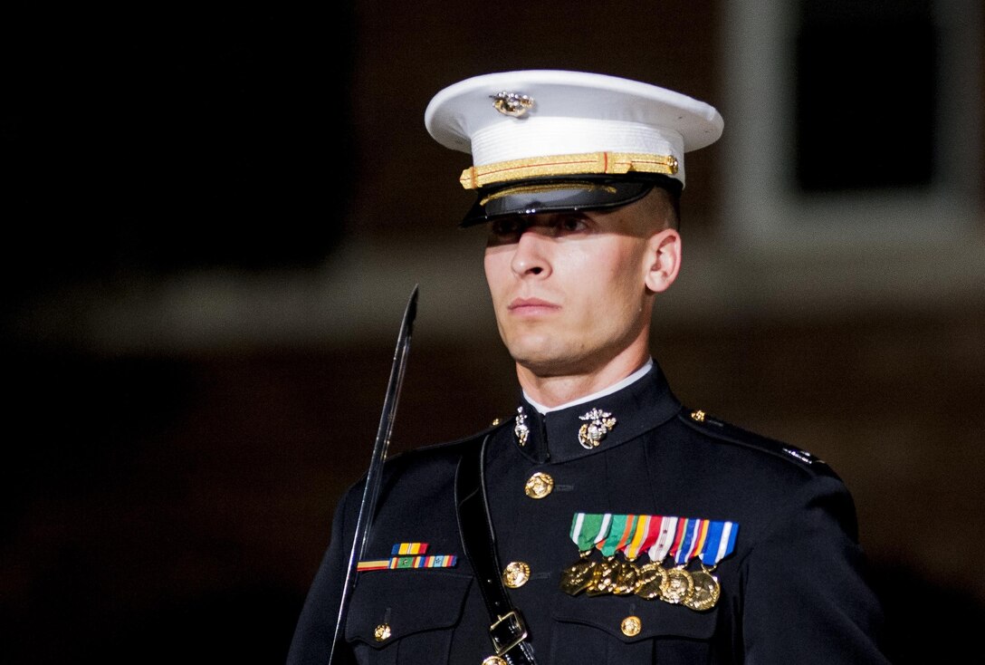 Capt. Jeffrey Clement, Marine Barracks Washington, D.C. marching staff adjutant, performs during a Friday Evening Parade at Marine Barracks Washington, D.C., May 31. (Official Marine Corps photo by Lance Cpl. Dan Hosack/Released)