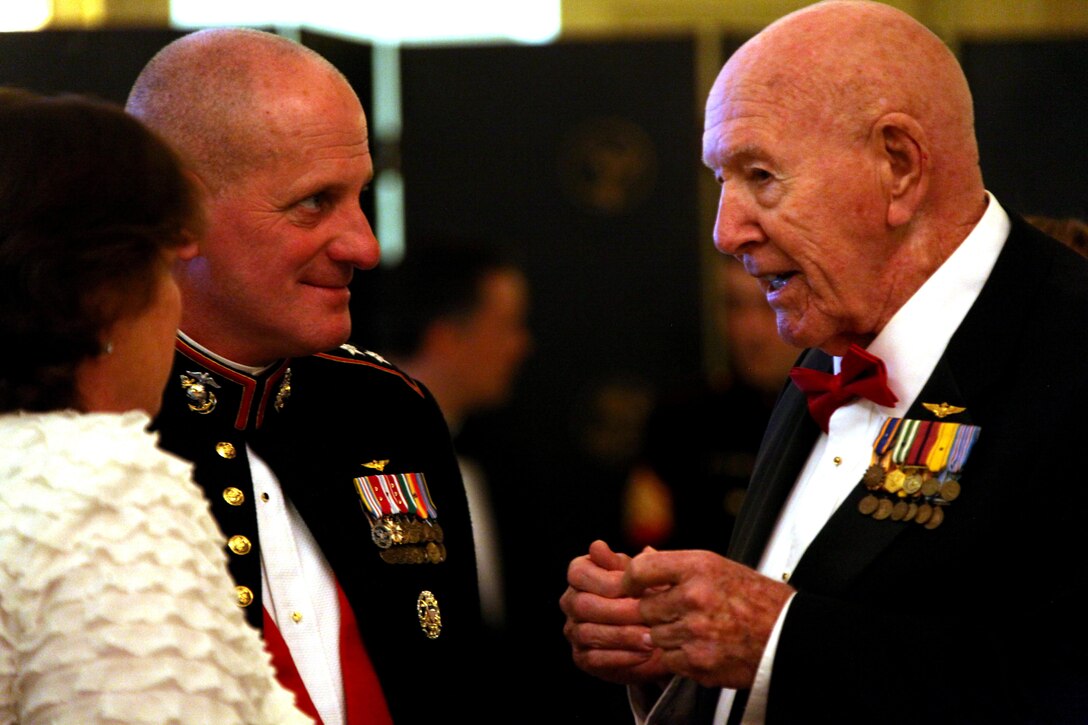 Maj. Gen. Steven Busby, left, the commanding general of 3rd Marine Aircraft Wing, and Cindy Busby, his wife, converse with Glenn Ferguson, right, founder of the Irene Ferguson Marine Wife Recognition Award and Harvey, Ill., native, at the 8th Annual Flying Leatherneck Historical Foundation Black Tie Gala at the Westgate Hotel, San Diego, June 1. Ferguson founded the award in memory of his own wife, Irene Ferguson, to raise awareness of the service and sacrifice of the military wife. 