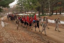 Recruiting Station Twin Cities' Commanding Officer Maj. Kenneth Gawronski and Sgt. Maj. Sean. P. Cox lead nearly 800 mini boot camp participants and coordinators on a five-mile hike with weighted packs April 28. The hike initially started out as a 3.5-mile exercise, but extended due to the lack of people falling out. For additional imagery from the event, visit www.facebook.com/rstwincities.