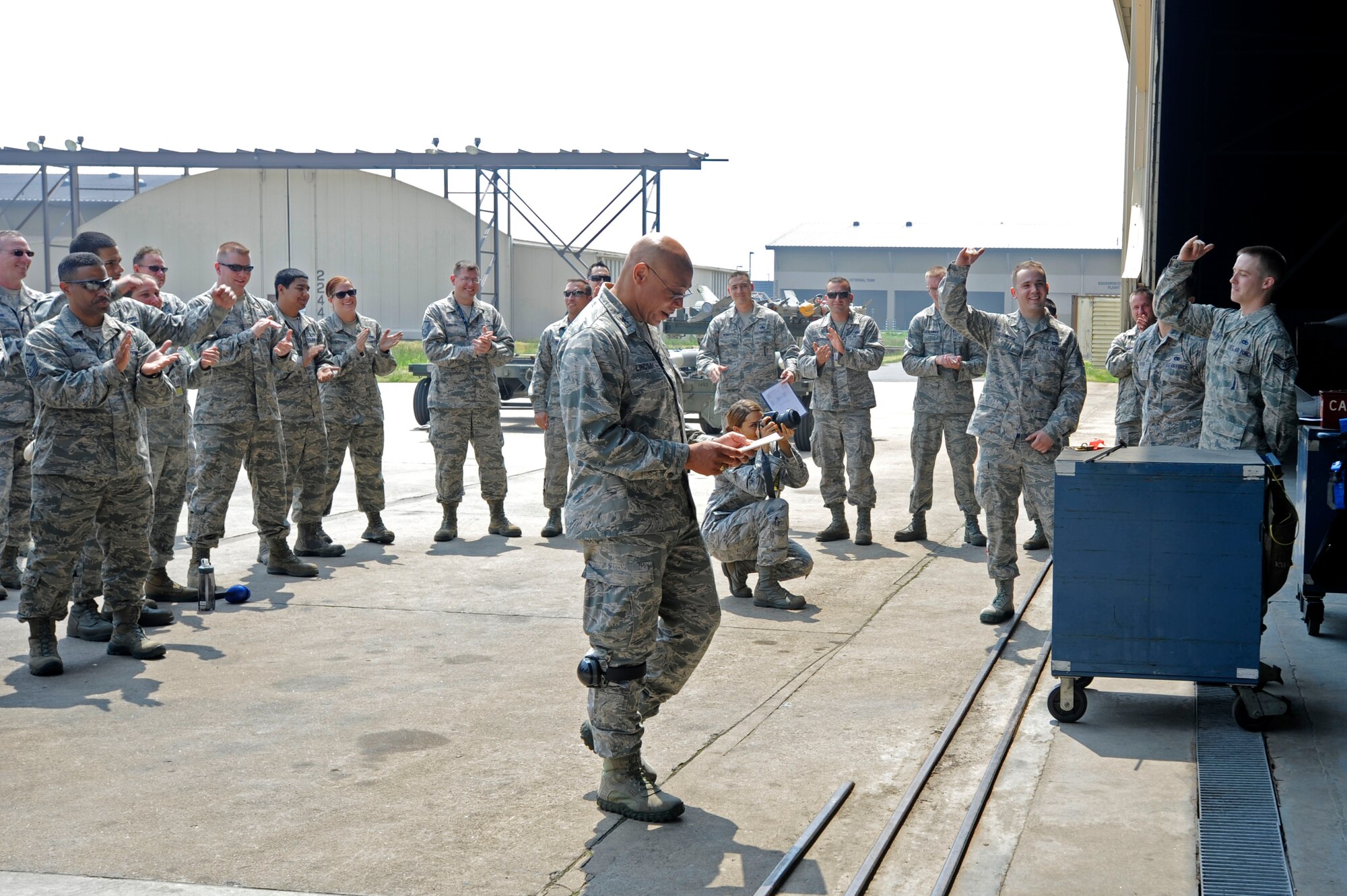 KUNSAN AIR BASE, Republic of Korea – Col. Ray Lindsay, 8th Maintenance Group commander announces the 35th Aircraft Maintenance Unit team as the winners of the weapons load crew competition at Kunsan Air Base Republic of Korea, May 23, 2013. The teams from the 35th AMU have won the last two competitions, and will go on to represent Kunsan during the peninsula wide weapons load crew competition. (U.S. Air Force photo by Staff Sgt. Tong Duong/ Released) 